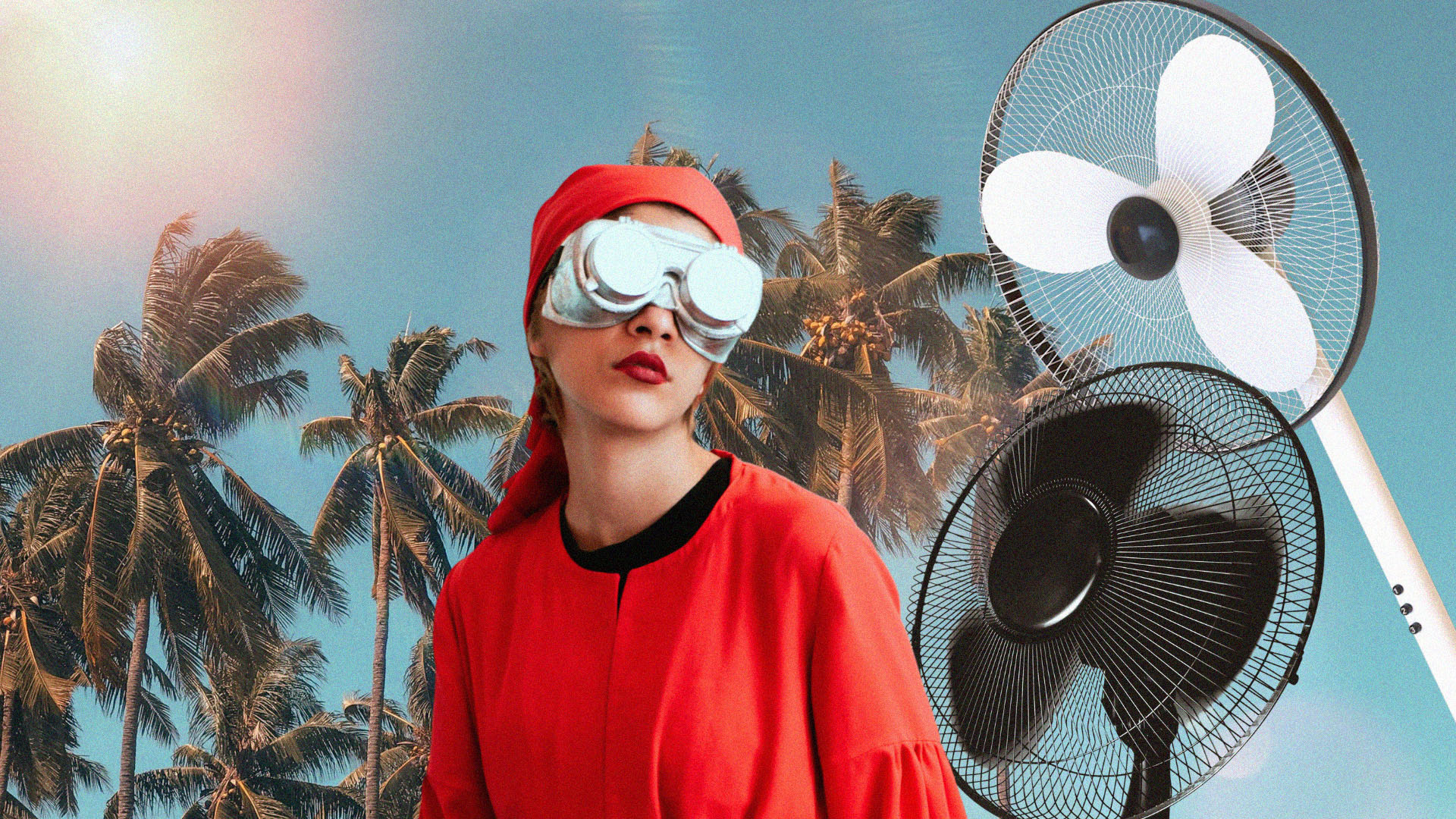 A person in block out goggles wears a red bandana and top. In the background are palm trees and big fans.