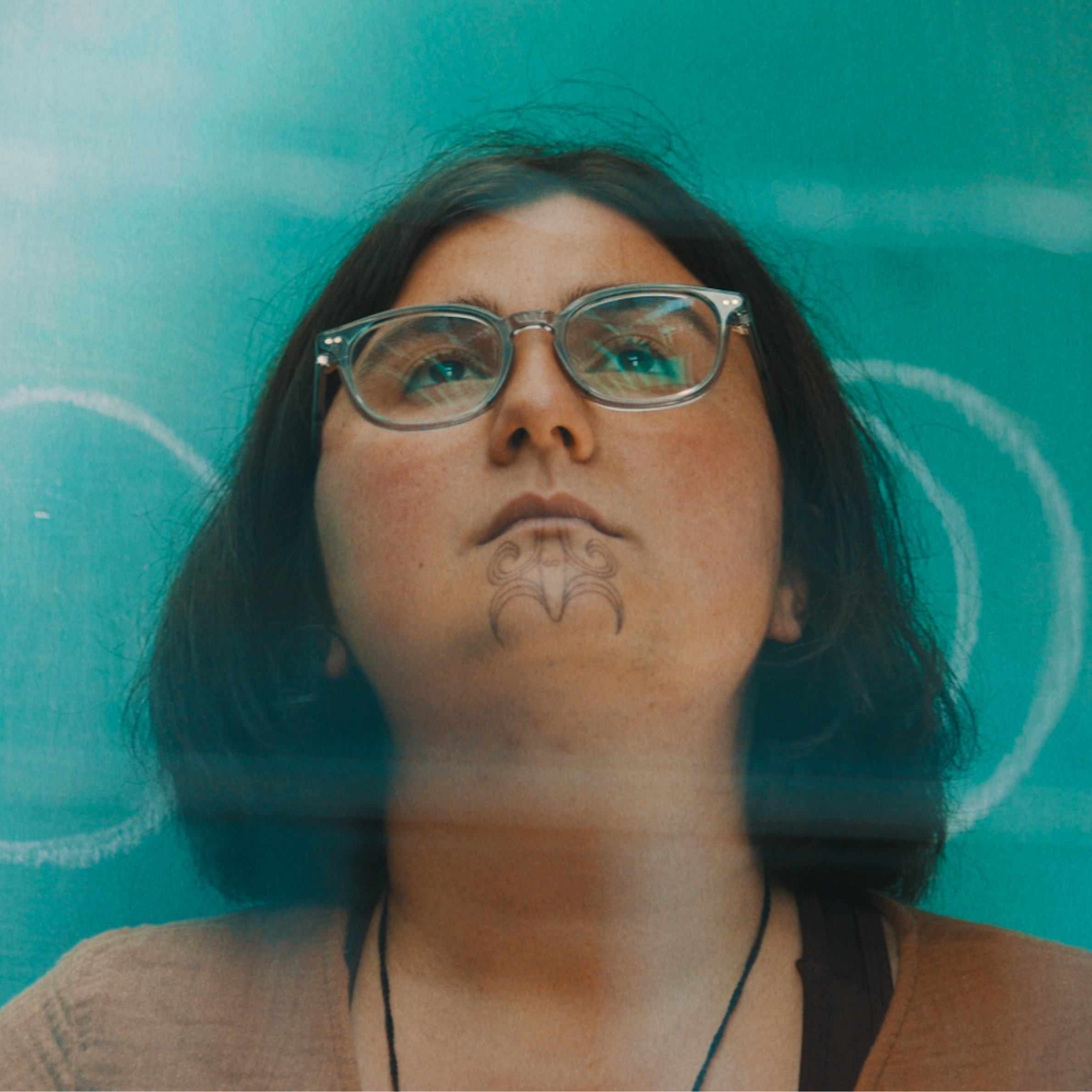 Ruby Solly is a Māori woman with moko kauae and has shoulder-length brown hair .
