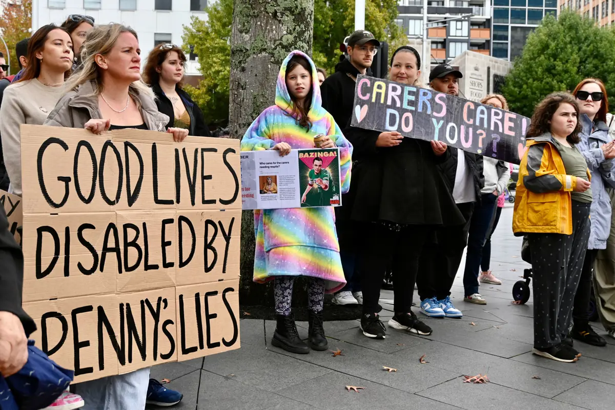 Disabled Protest Signs Tāmaki Makaurau disability communities protest funding cuts | The D*List