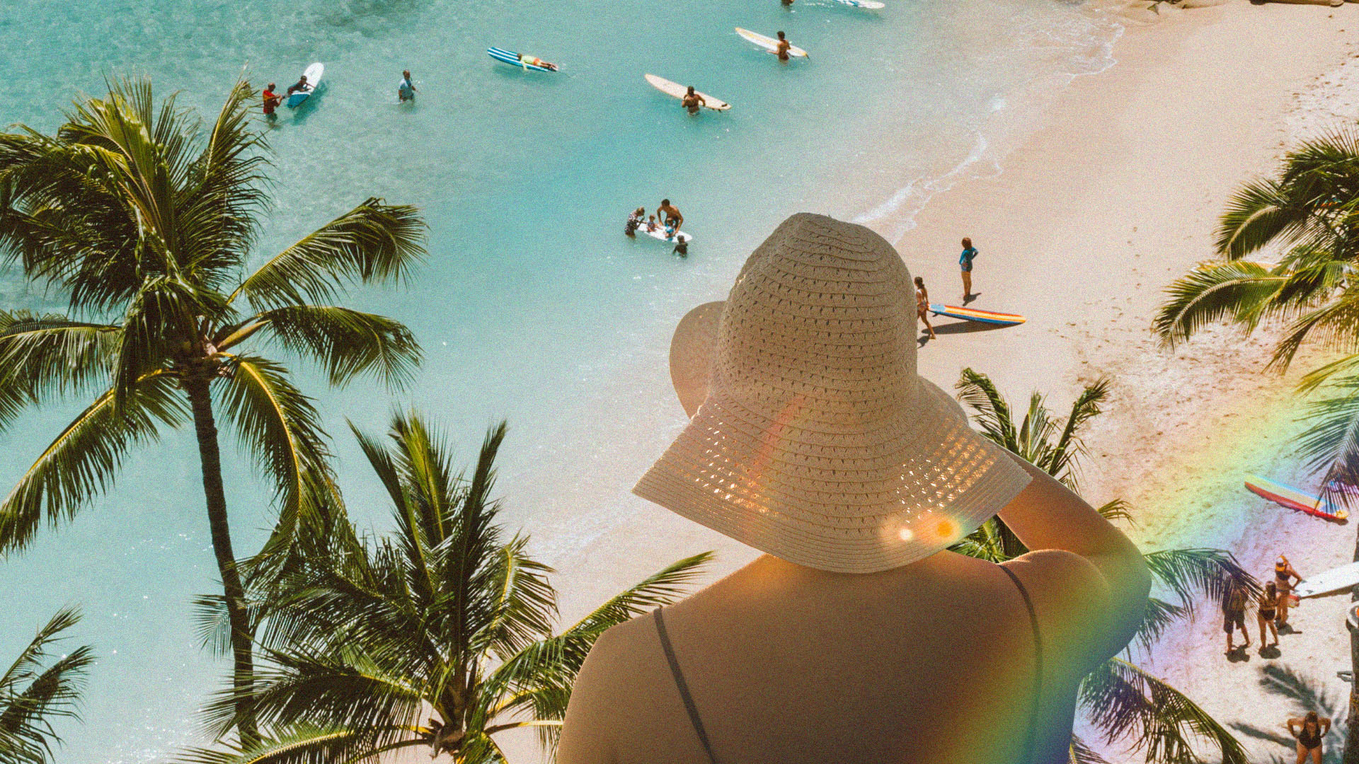 A person wears summer hut and looks at a beach scene of palm trees and surfers from a distance; there is a rainbow coming from her body.