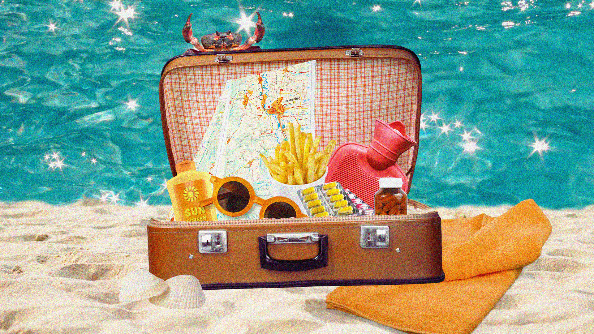 A vintage suitcase is filled with sunblock, sunglasses, a map, hot chips, medicine and a red hot water bottle. The background is a sandy beach with sparkling water.