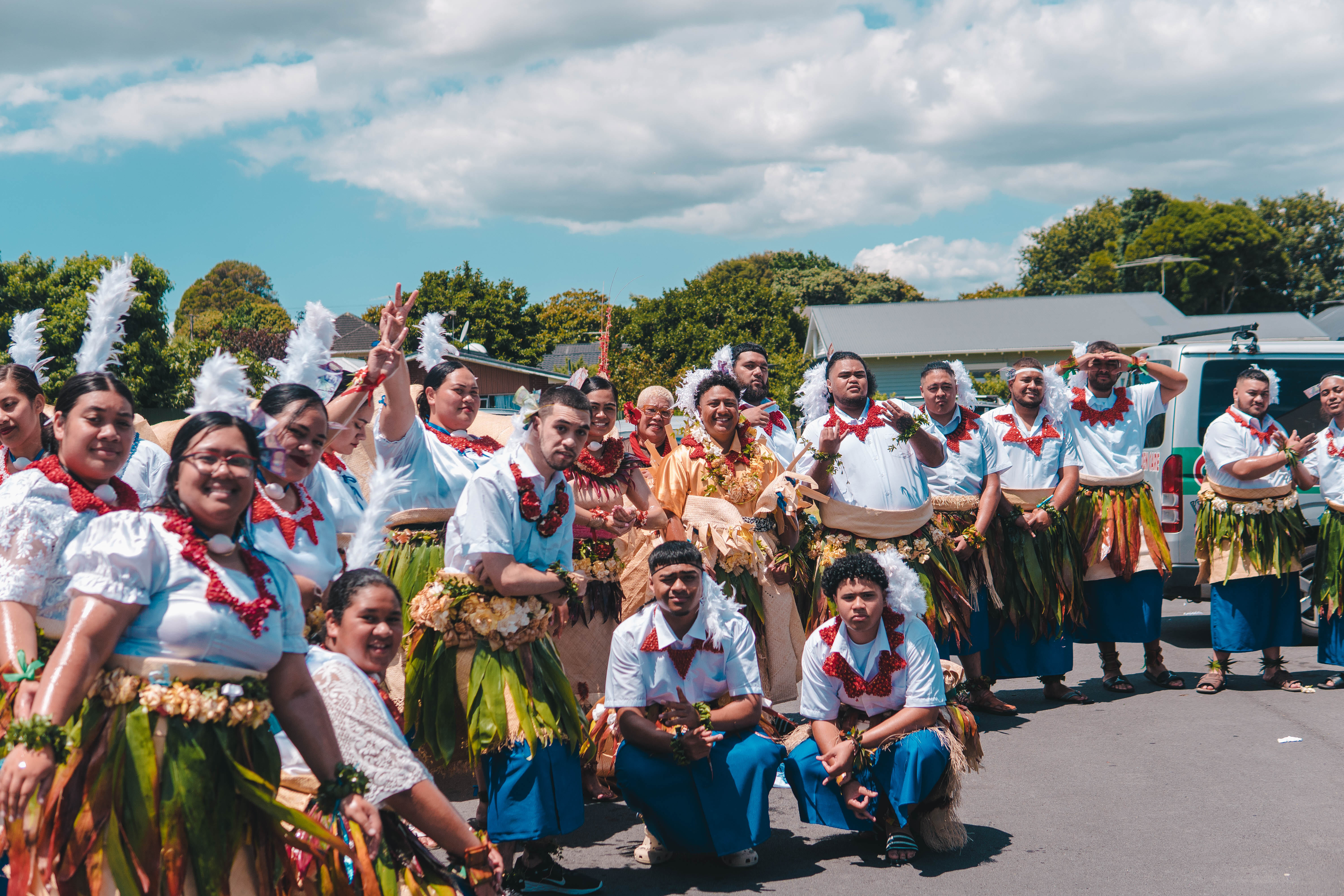 Will and his Tongan youth group dressed in traditional Tongan attire, standing together at their 40th jubilee celebration.