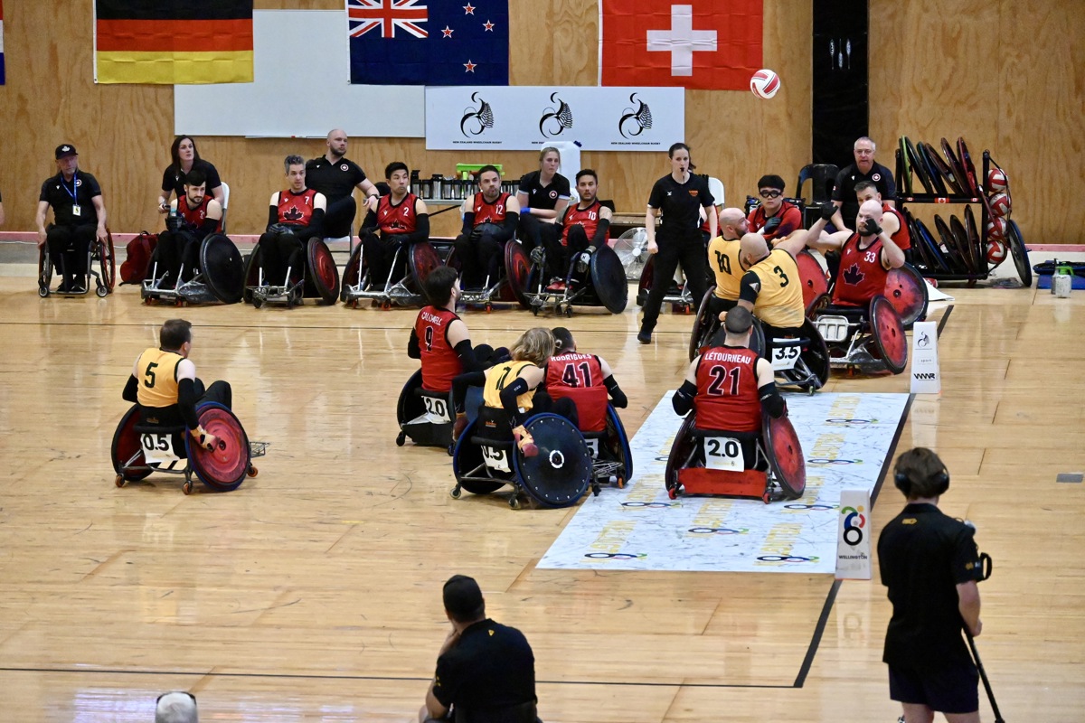 Athletes from Canada and Australia play in the final game of the wheelchair rugby tournament. 