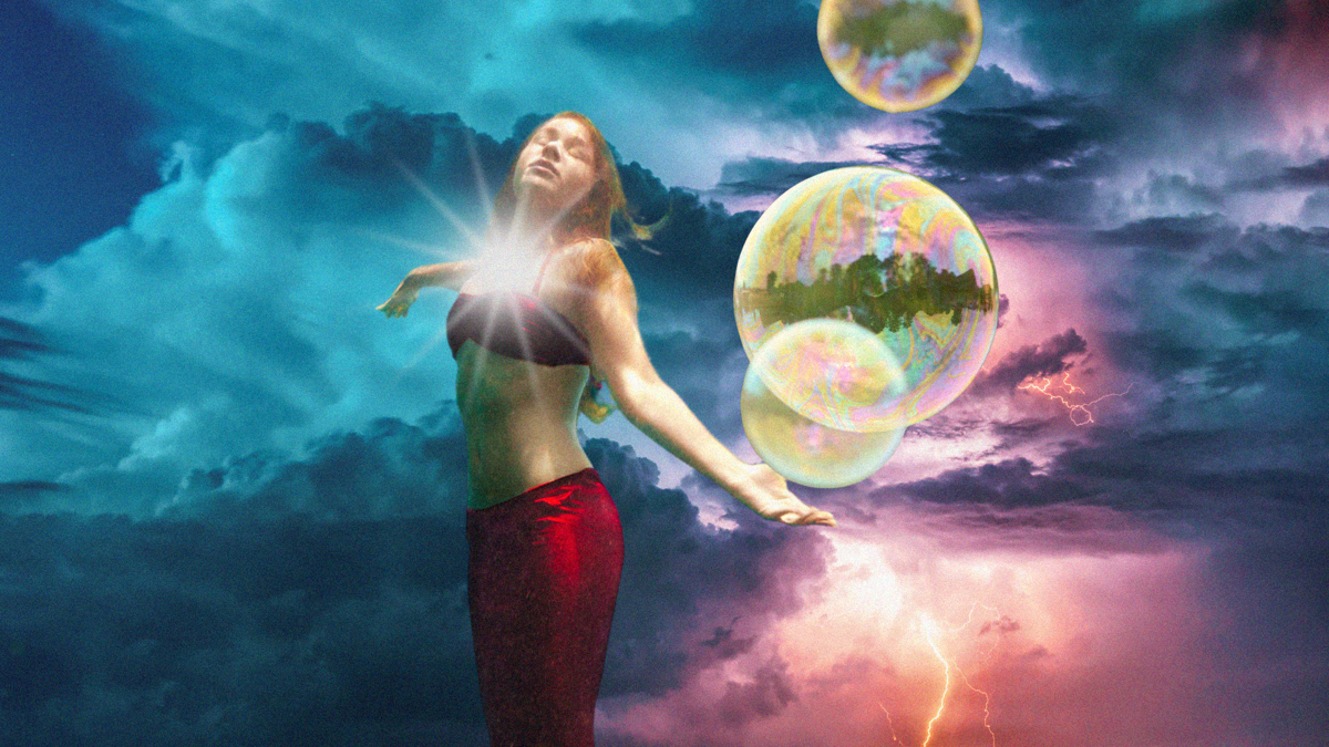 A mermaid floats up into a magical-looking sky with lightning and bubbles in the background.