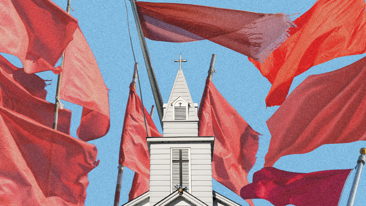 A church surrounded by red flags