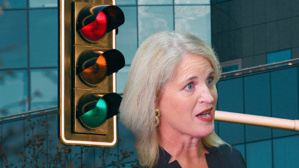 Minister Louise Upston pictured with traffic lights looming over her.